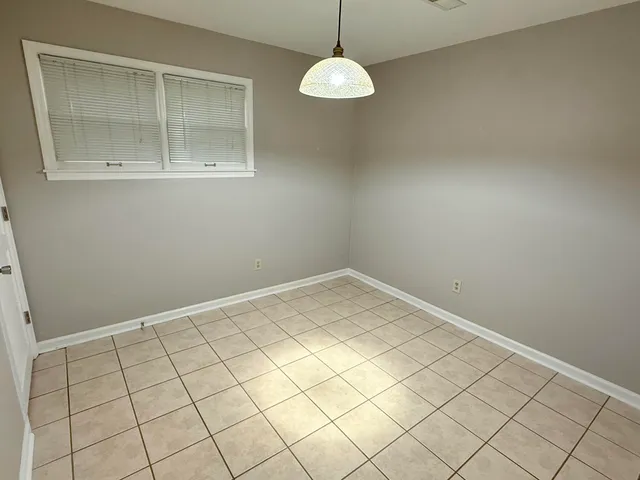 a view of wooden floor in an empty room