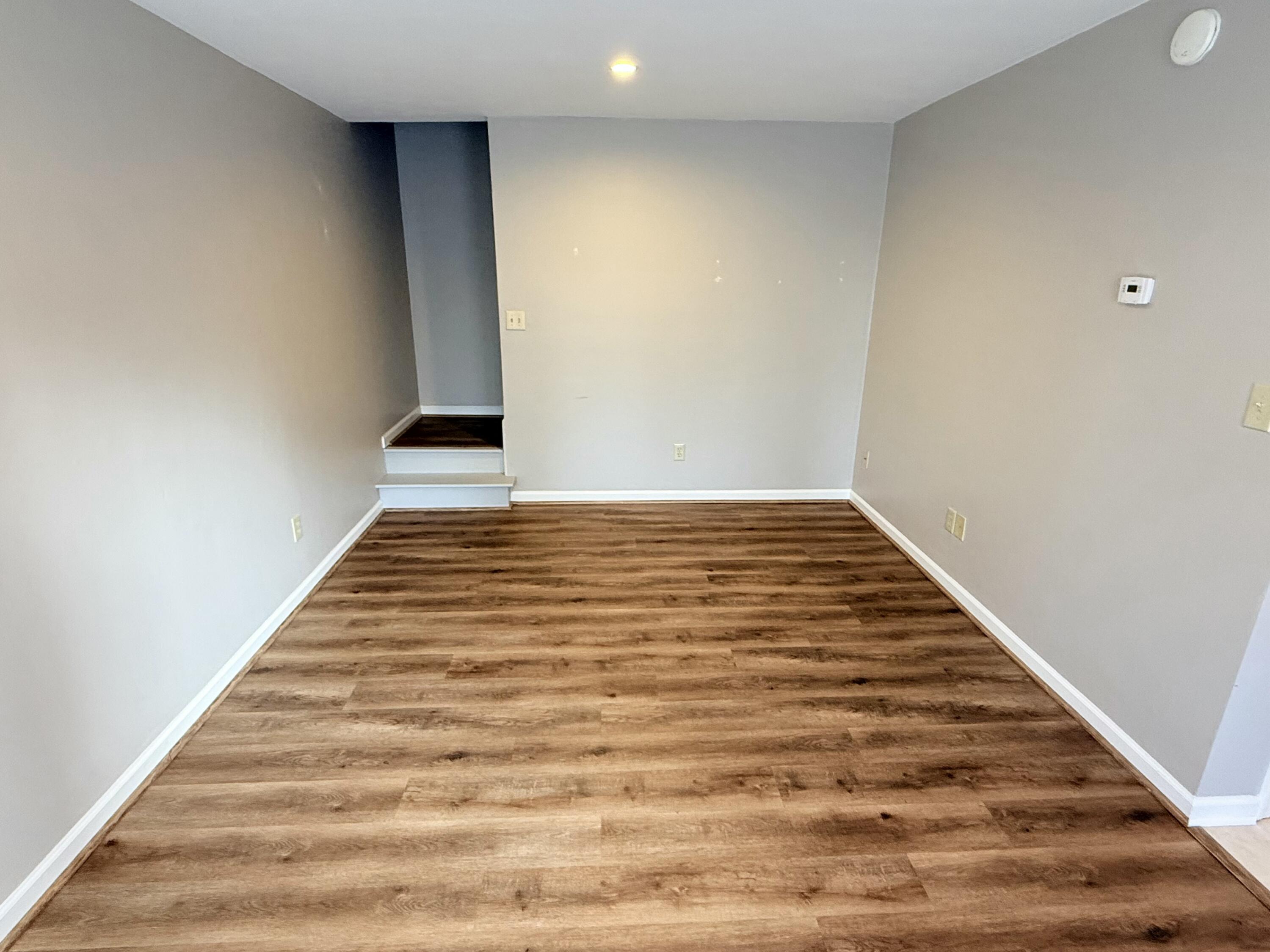 2317 Broadway Avenue Southwest, Unit E Roanoke, VA 24014 - Photo 10 of 20 a view of empty room with wooden floor
