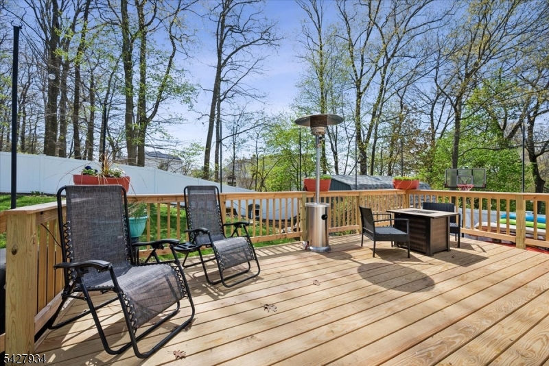 77 Brooklyn Road Stanhope, NJ 07874 - Photo 18 of 27 a view of a patio on the deck and a backyard