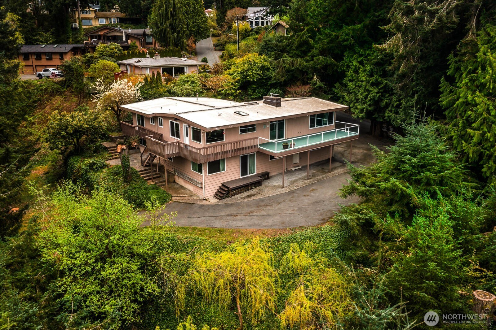 7413 Soundview Drive Edmonds, WA 98026 - Photo 1 of 31 an aerial view of a house with a yard table and chairs