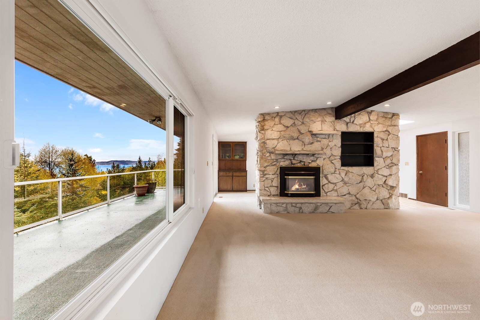 7413 Soundview Drive Edmonds, WA 98026 - Photo 11 of 31 a view of a living room hardwood floor and a fireplace