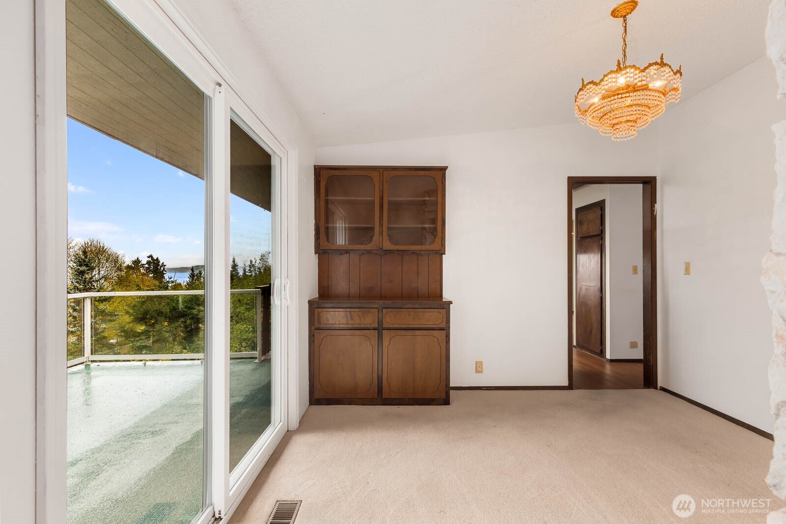 7413 Soundview Drive Edmonds, WA 98026 - Photo 13 of 31 a view of a hallway with a chandelier