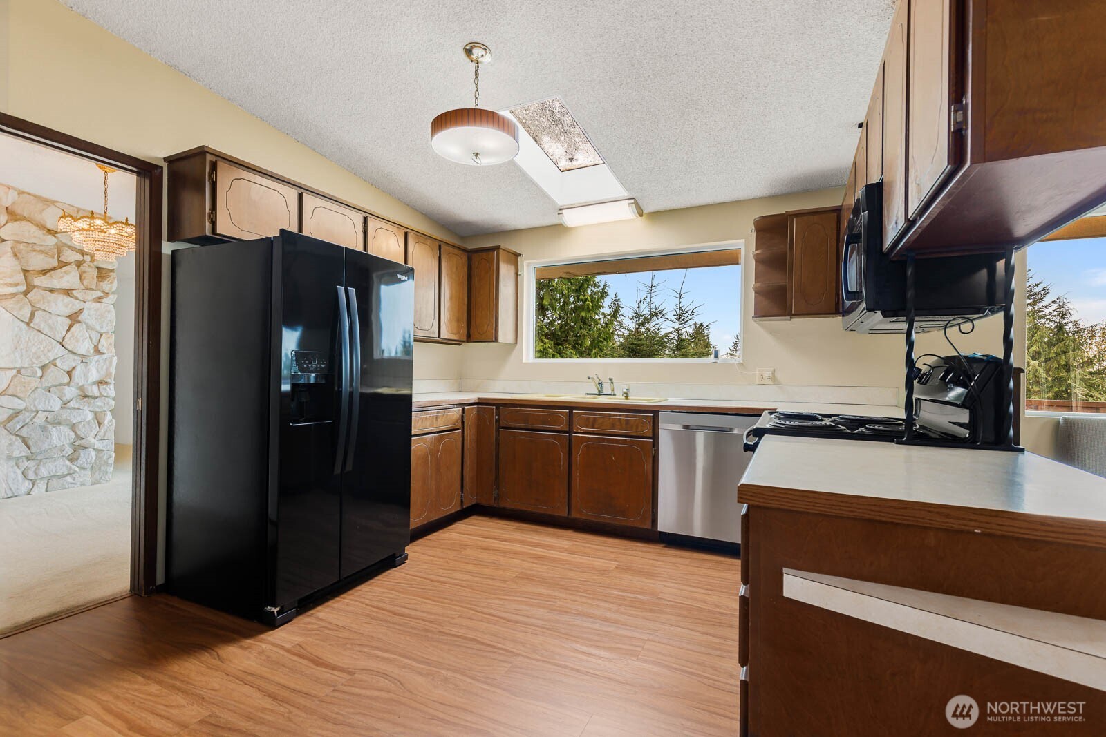 7413 Soundview Drive Edmonds, WA 98026 - Photo 14 of 31 a kitchen with stainless steel appliances a refrigerator and a stove