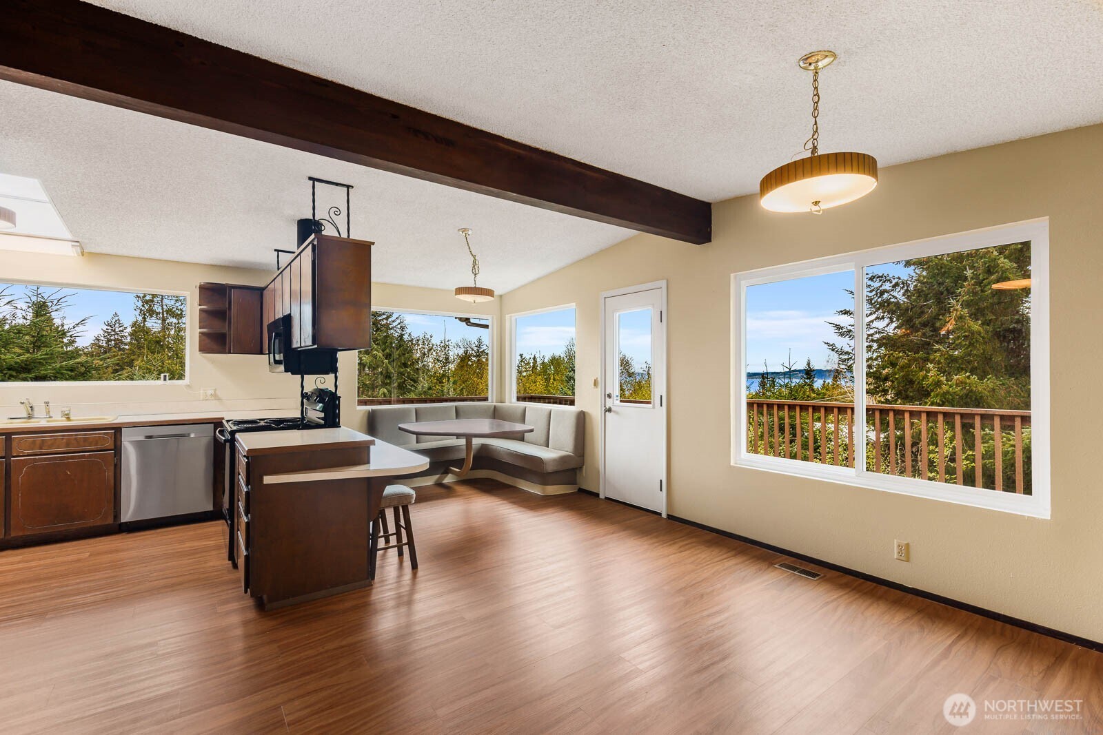 7413 Soundview Drive Edmonds, WA 98026 - Photo 16 of 31 a view of a dining room with furniture window and wooden floor