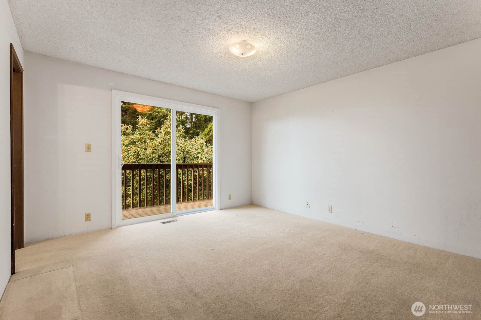 7413 Soundview Drive Edmonds, WA 98026 - Photo 19 of 31 a view of an empty room with a balcony
