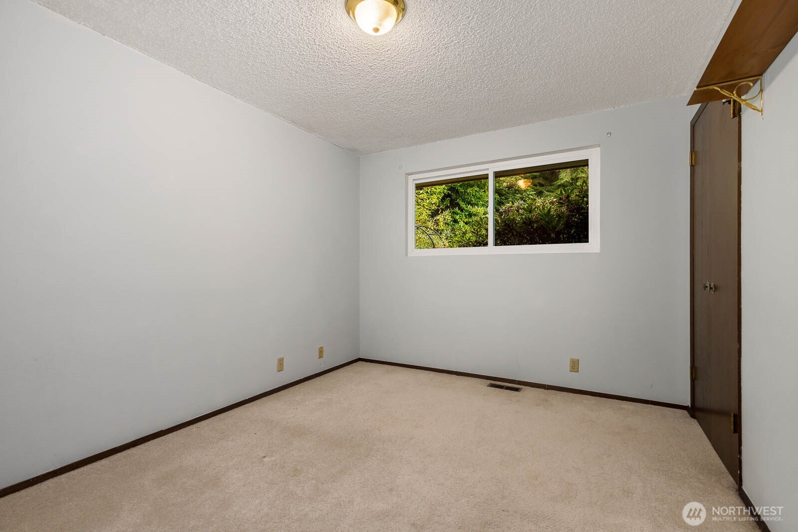 7413 Soundview Drive Edmonds, WA 98026 - Photo 21 of 31 a view of an empty room with a window