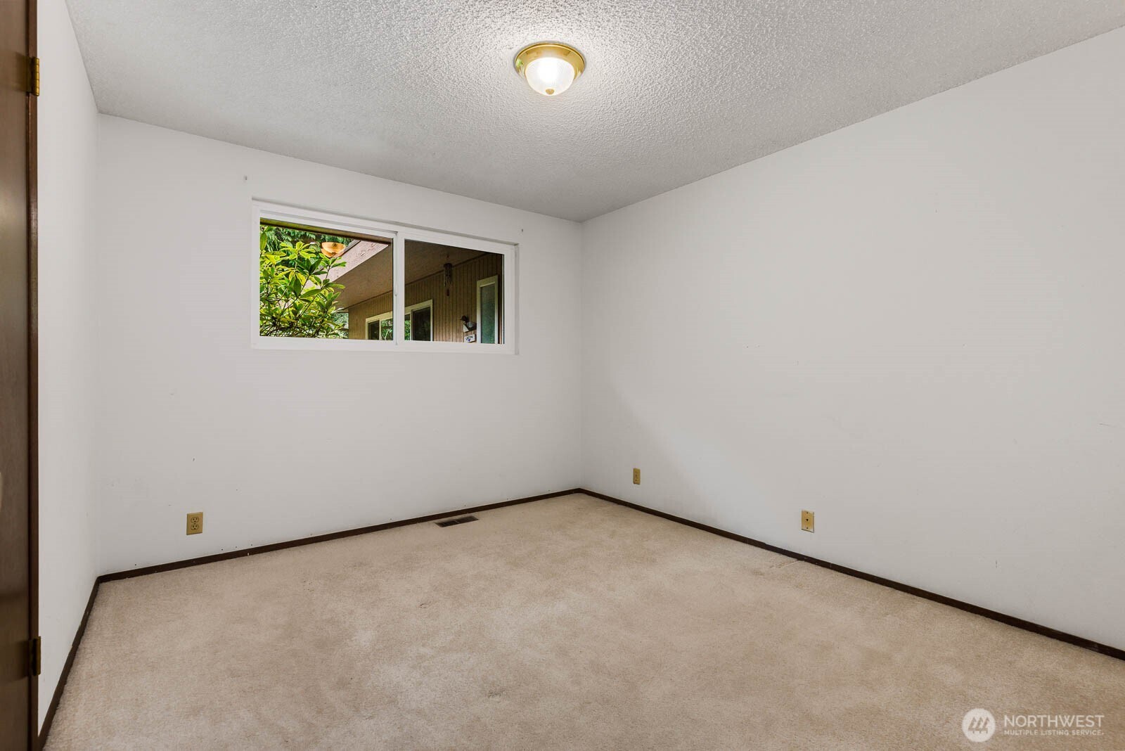7413 Soundview Drive Edmonds, WA 98026 - Photo 22 of 31 an empty room with a window