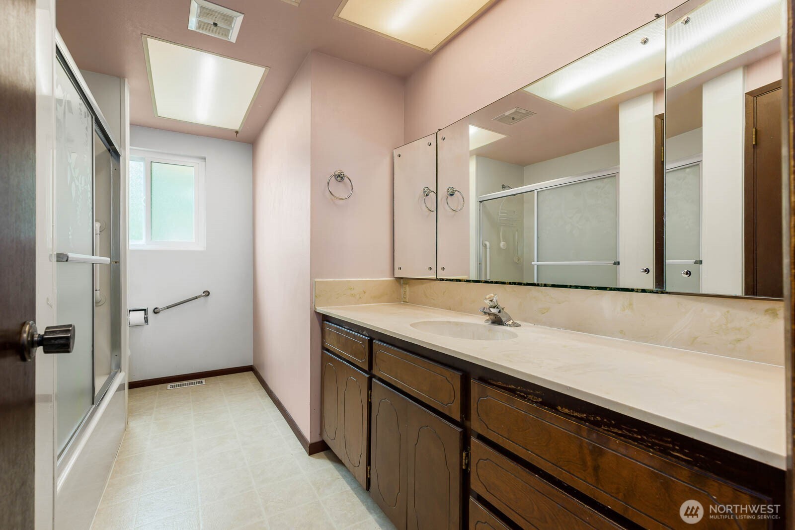 7413 Soundview Drive Edmonds, WA 98026 - Photo 23 of 31 a bathroom with a sink and a mirror