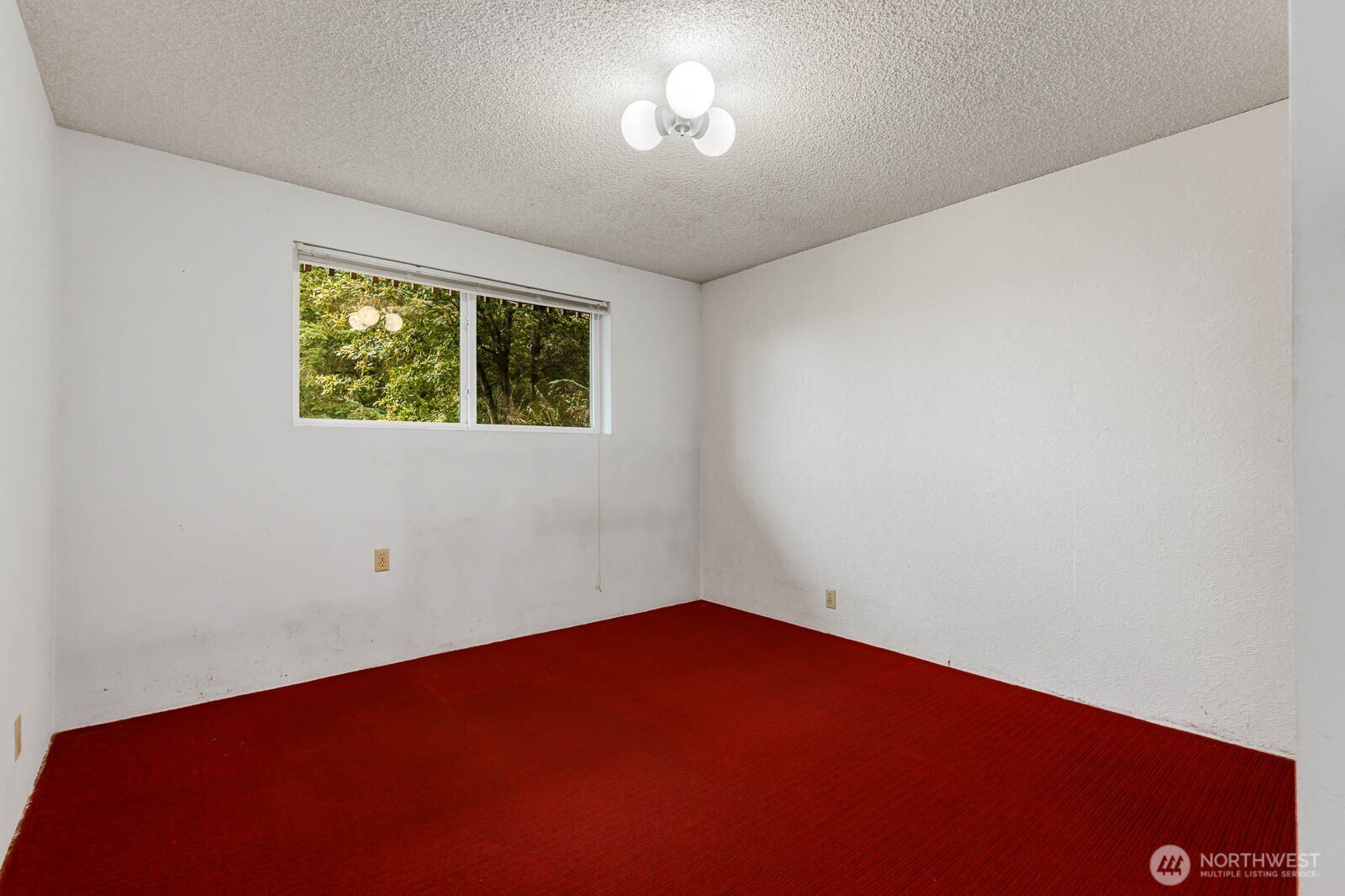 7413 Soundview Drive Edmonds, WA 98026 - Photo 27 of 31 an empty room with a window