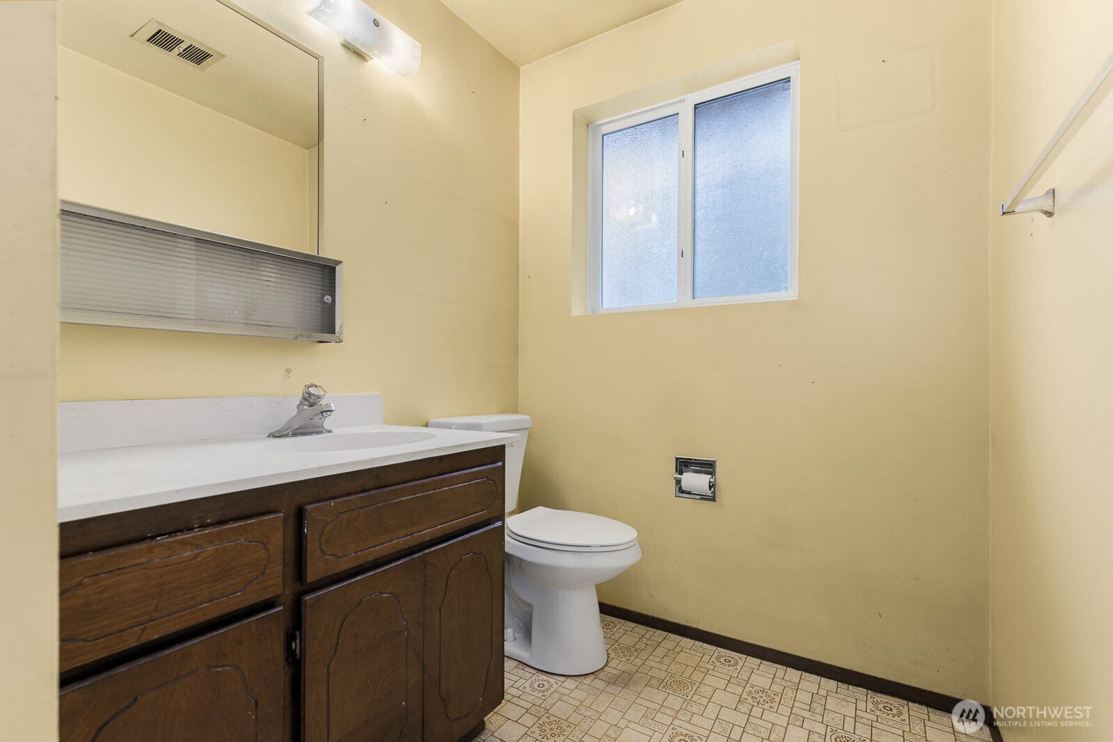 7413 Soundview Drive Edmonds, WA 98026 - Photo 29 of 31 a bathroom with a sink a toilet and mirror