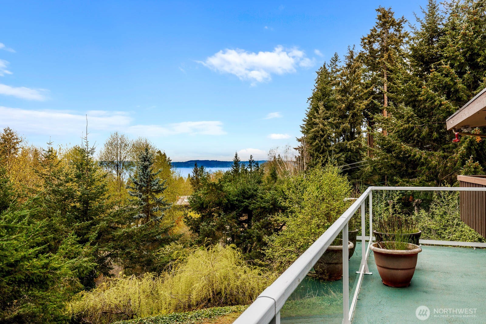 7413 Soundview Drive Edmonds, WA 98026 - Photo 5 of 31 a balcony with wooden floor and lake view