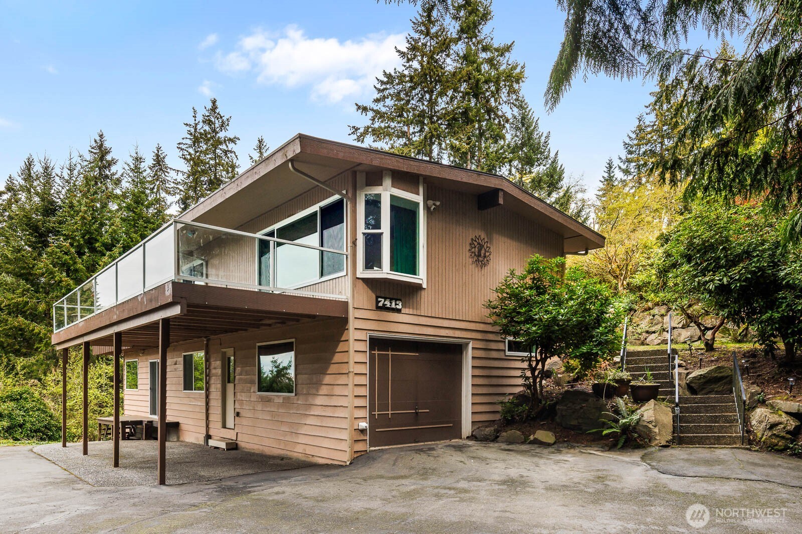 7413 Soundview Drive Edmonds, WA 98026 - Photo 8 of 31 a front view of a house with a garden