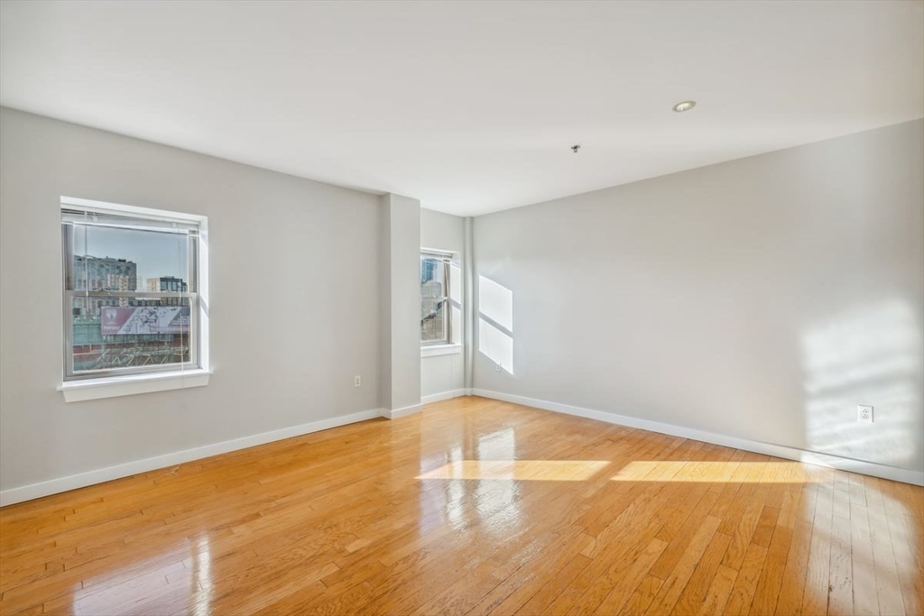 534-538 Commonwealth Avenue, Unit 7D Boston, MA 02215 - Photo 3 of 17 a view of empty room with wooden floor