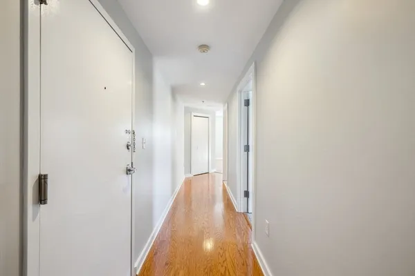 a view of a hallway with white walls