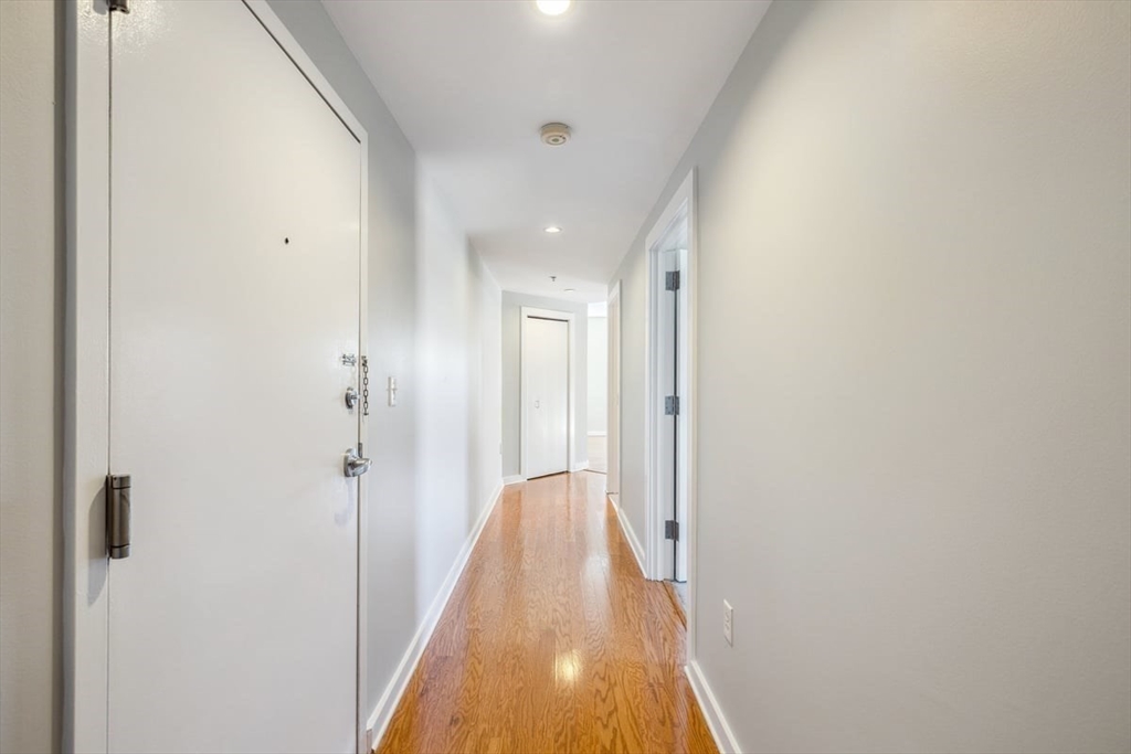 534-538 Commonwealth Avenue, Unit 7D Boston, MA 02215 - Photo 7 of 17 a view of a hallway with white walls