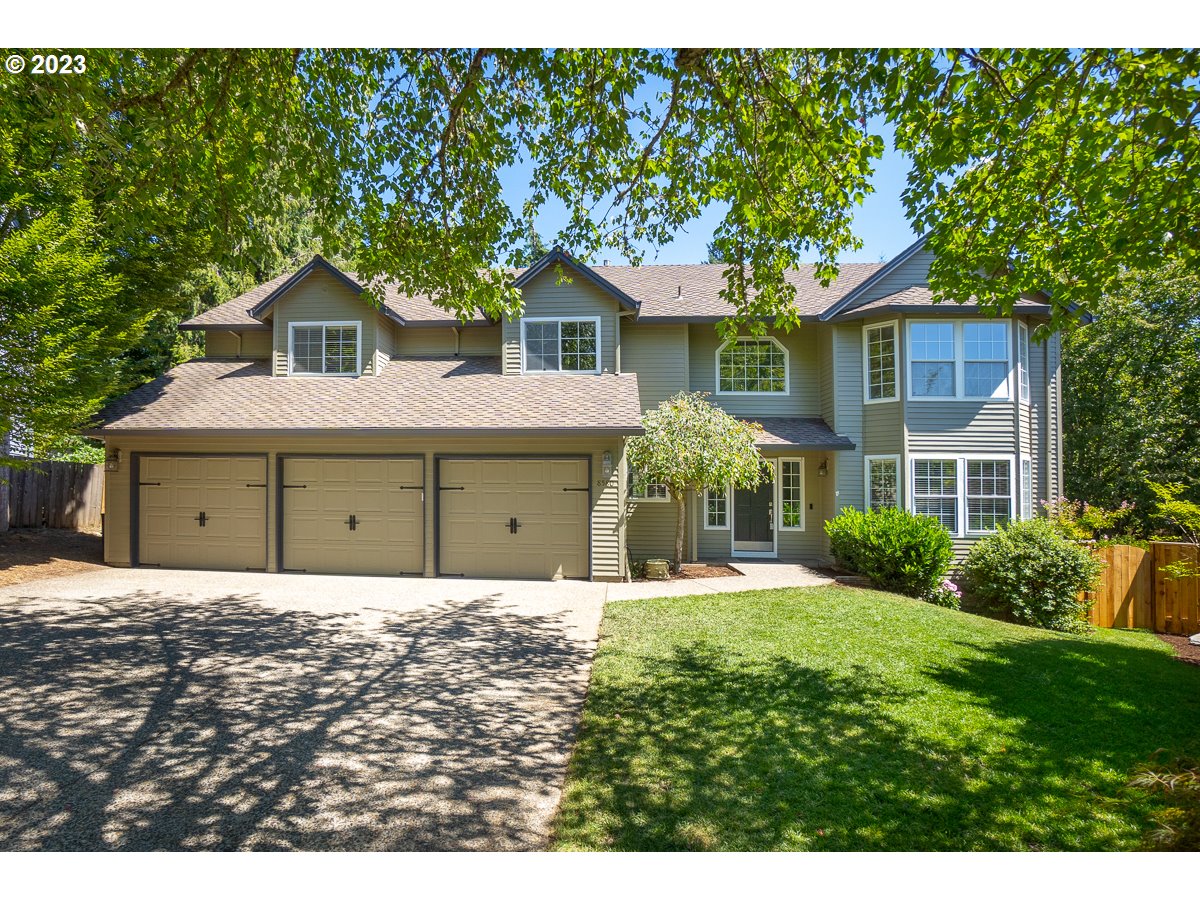 a house with a tree in front of it