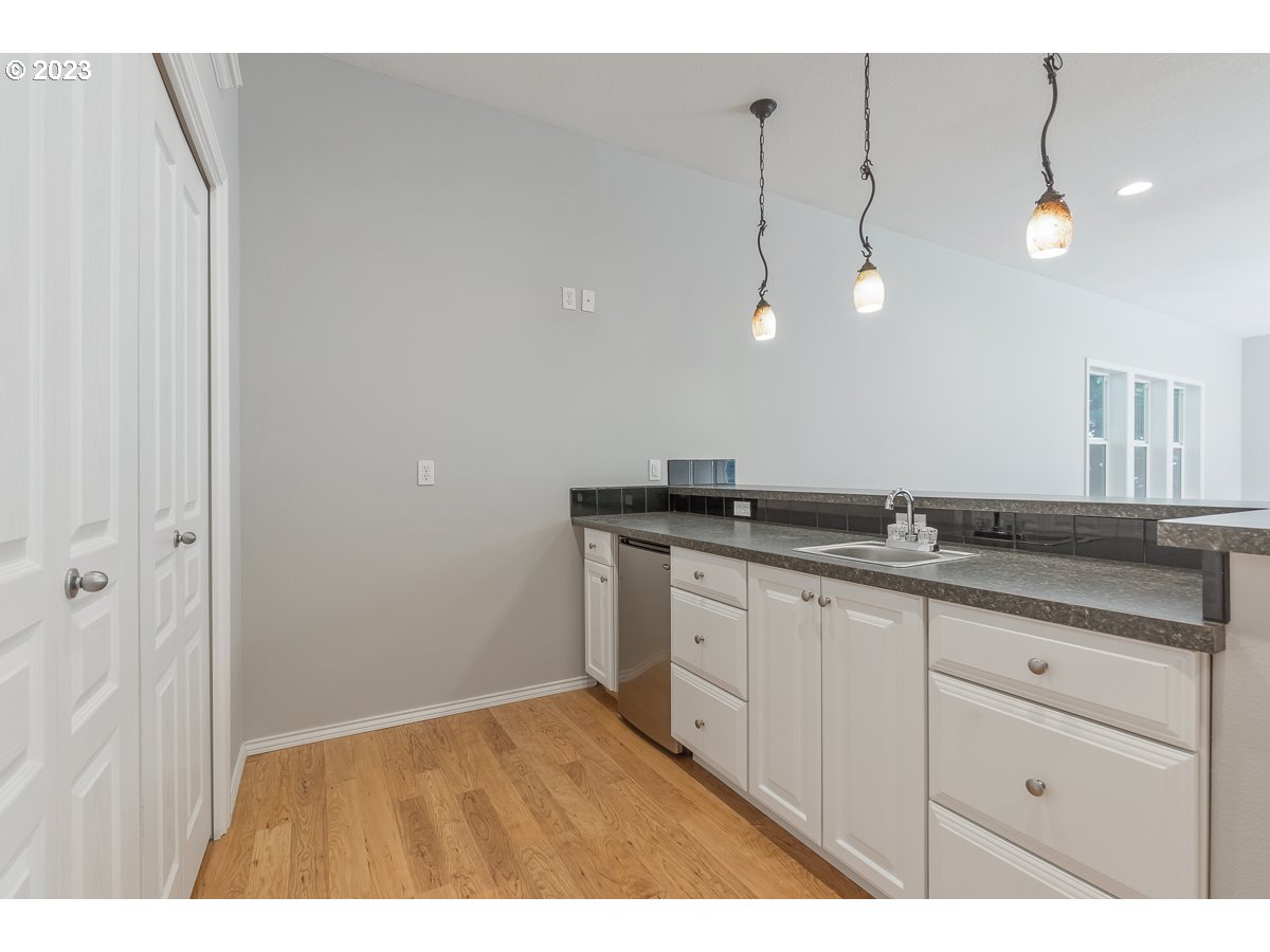 8580 Southwest Thoroughbred Place Beaverton, OR 97008 - Photo 16 of 43 a bathroom with a sink and a mirror