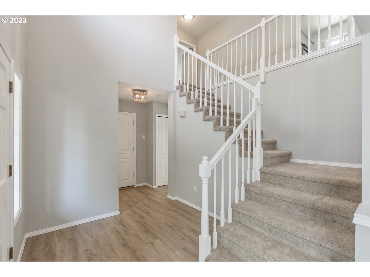 8580 Southwest Thoroughbred Place Beaverton, OR 97008 - Photo 2 of 43 a view of entryway with wooden floor