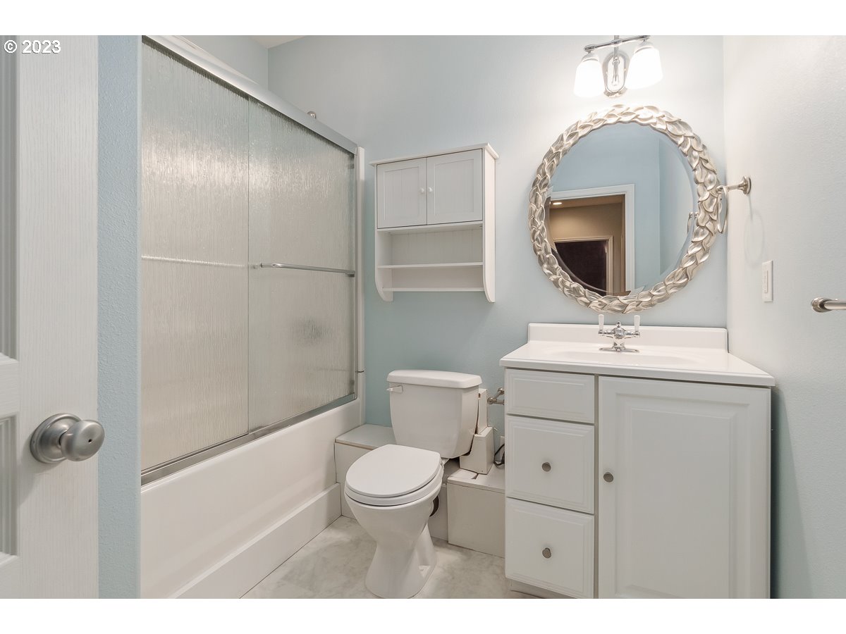 8580 Southwest Thoroughbred Place Beaverton, OR 97008 - Photo 21 of 43 a bathroom with a toilet sink and mirror