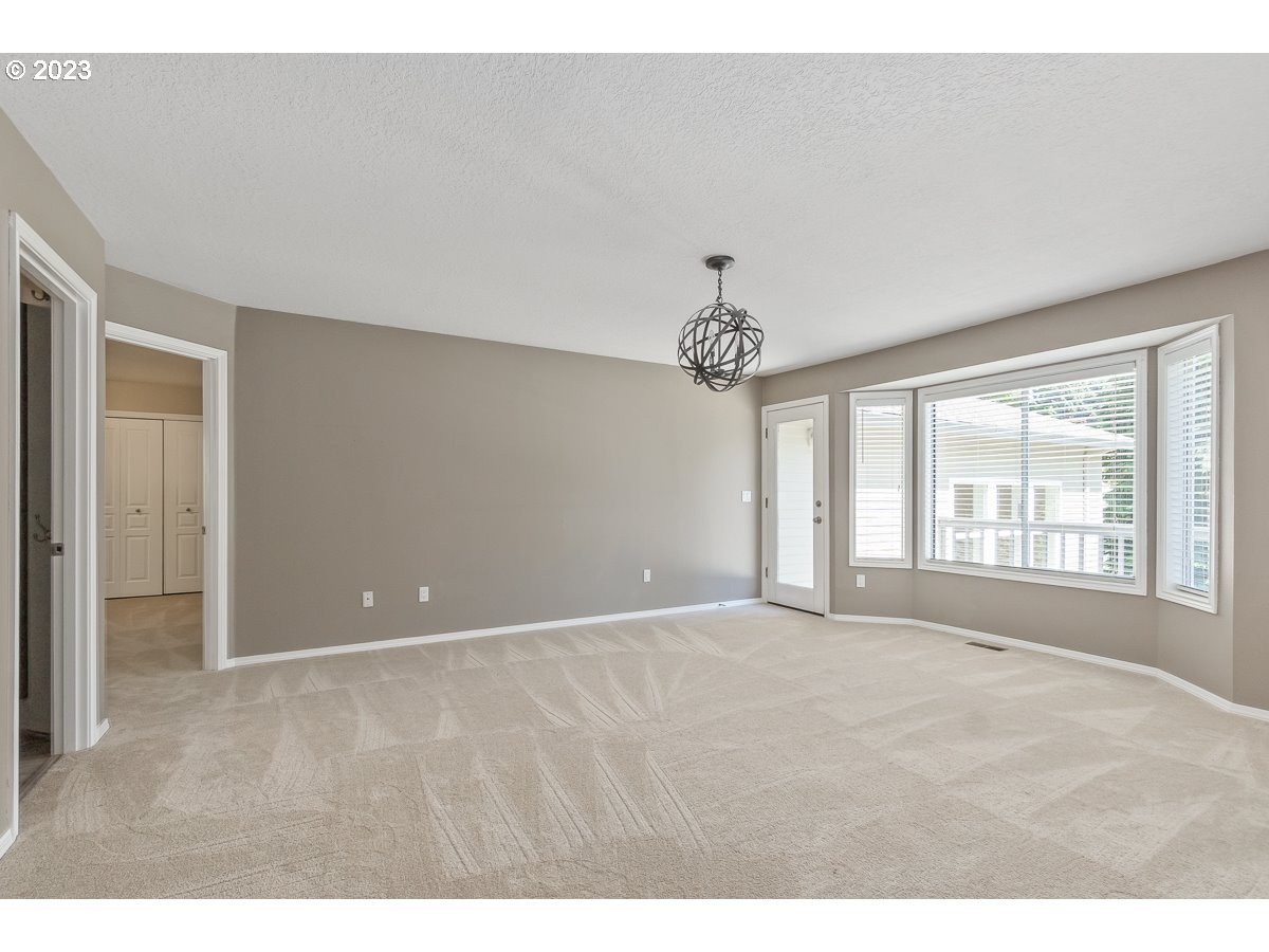8580 Southwest Thoroughbred Place Beaverton, OR 97008 - Photo 22 of 43 a view of an empty room with a window