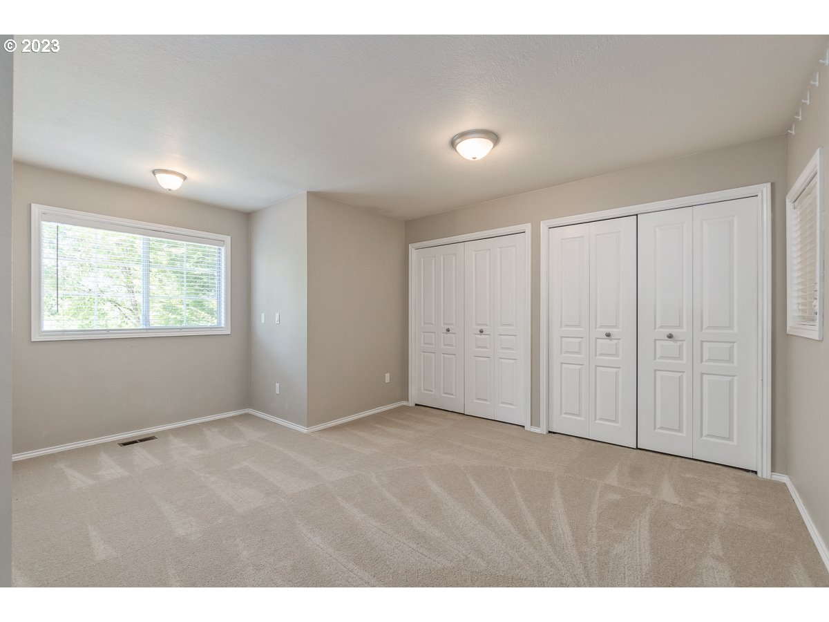 8580 Southwest Thoroughbred Place Beaverton, OR 97008 - Photo 26 of 43 a view of an empty room and a window