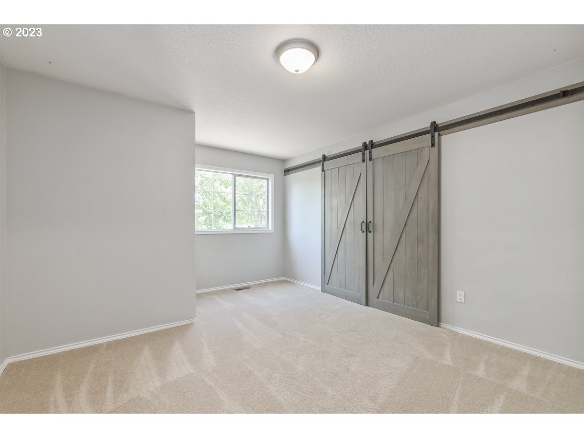 8580 Southwest Thoroughbred Place Beaverton, OR 97008 - Photo 27 of 43 a view of an empty room with a window