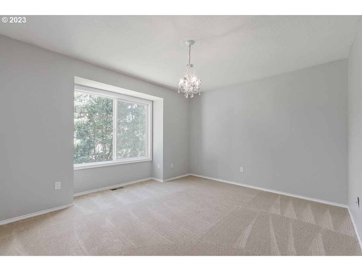 8580 Southwest Thoroughbred Place Beaverton, OR 97008 - Photo 28 of 43 a view of an empty room with a window
