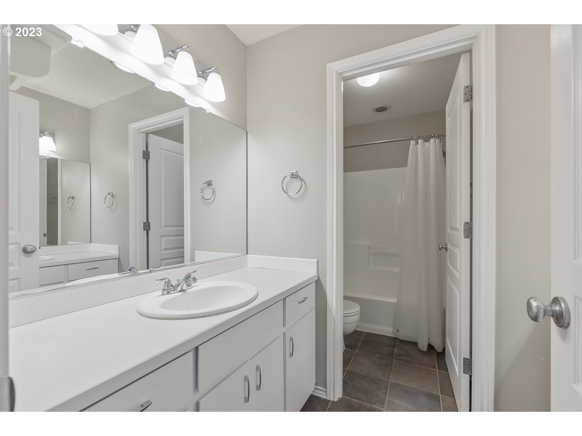 8580 Southwest Thoroughbred Place Beaverton, OR 97008 - Photo 30 of 43 a bathroom with a sink shower and a mirror