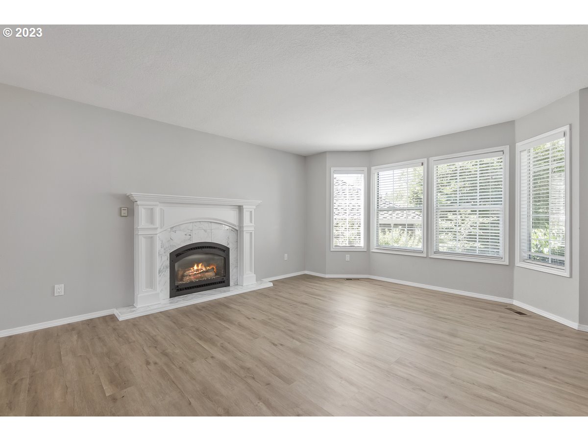 8580 Southwest Thoroughbred Place Beaverton, OR 97008 - Photo 3 of 43 a view of empty room with a fireplace