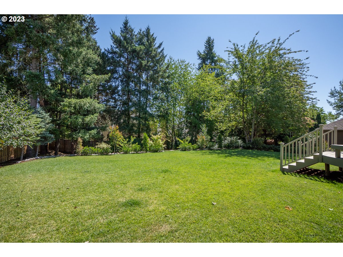 8580 Southwest Thoroughbred Place Beaverton, OR 97008 - Photo 35 of 43 a view of yard with grass and trees