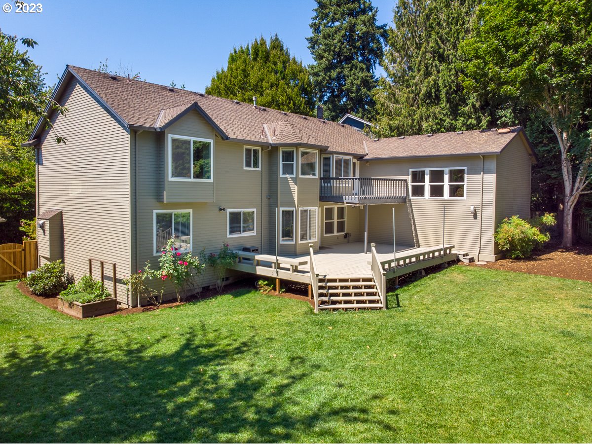 8580 Southwest Thoroughbred Place Beaverton, OR 97008 - Photo 42 of 43 a view of a house with a yard and sitting area