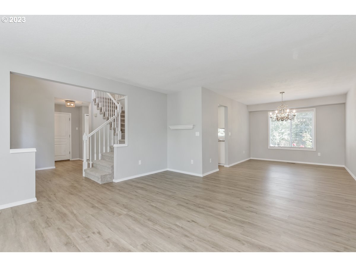 8580 Southwest Thoroughbred Place Beaverton, OR 97008 - Photo 5 of 43 a view of empty room with wooden floor