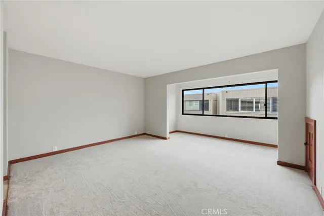 a spacious bedroom with a bed and furniture