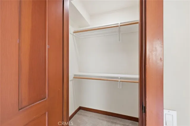 a bathroom with a granite countertop sink a mirror and a shower