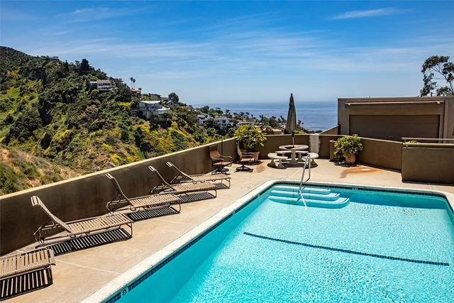 a view of a balcony with chairs