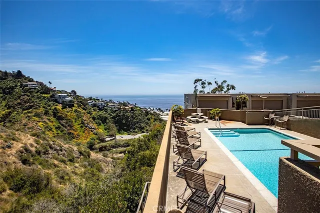 a view of a swimming pool with a lounge chairs