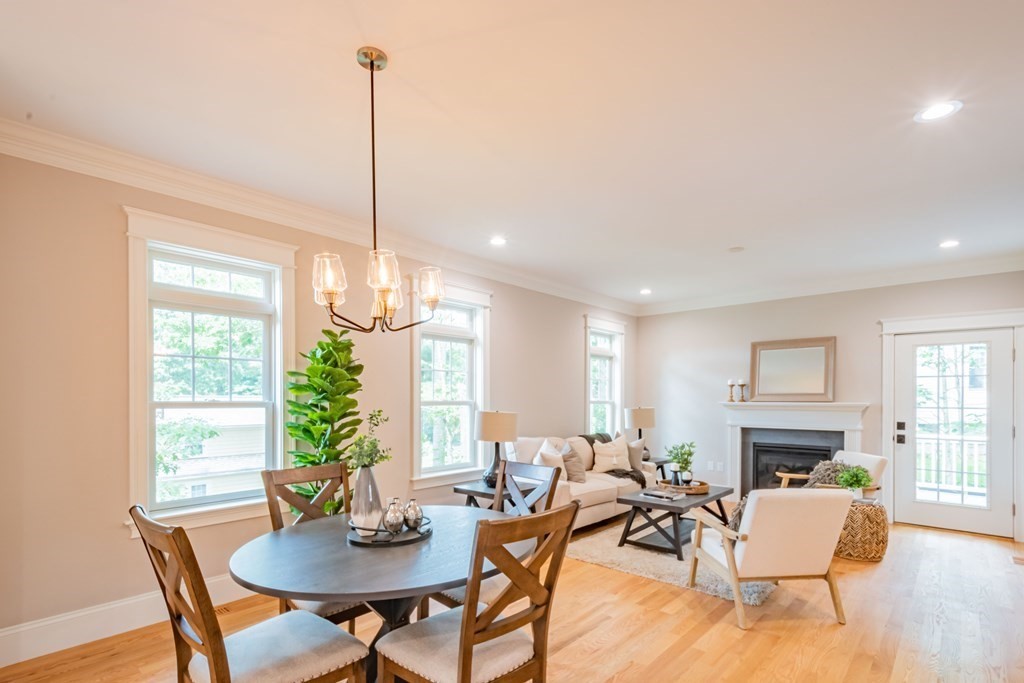 18 Pine Knoll Road Lexington, MA 02420 - Photo 15 of 42 a living room with furniture a fireplace and a chandelier