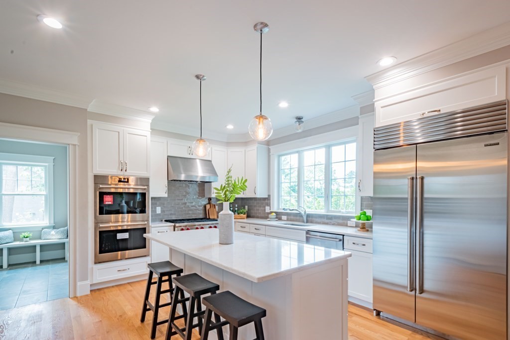 18 Pine Knoll Road Lexington, MA 02420 - Photo 16 of 42 a kitchen with stainless steel appliances granite countertop a refrigerator a sink and a stove