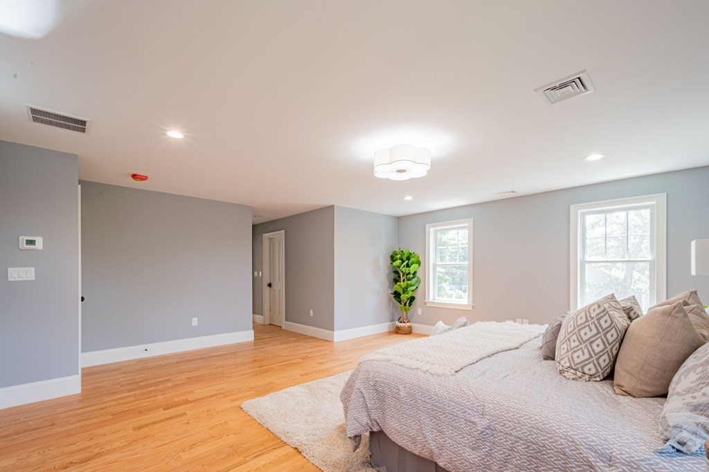 18 Pine Knoll Road Lexington, MA 02420 - Photo 26 of 42 a bedroom with a bed and ceiling fan