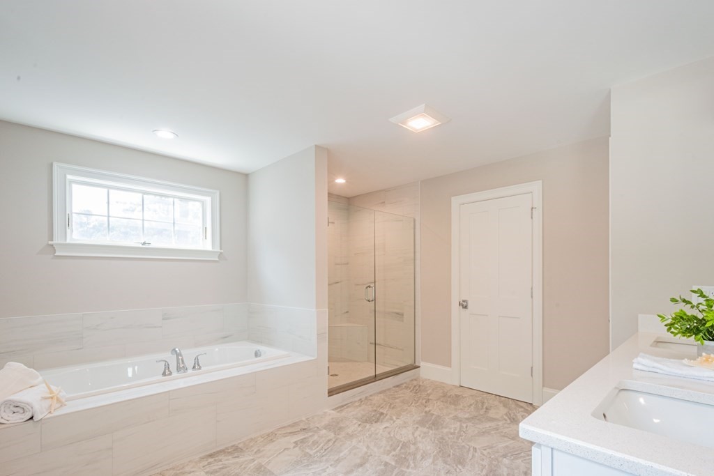 18 Pine Knoll Road Lexington, MA 02420 - Photo 27 of 42 a spacious bathroom with a bathtub and a sink