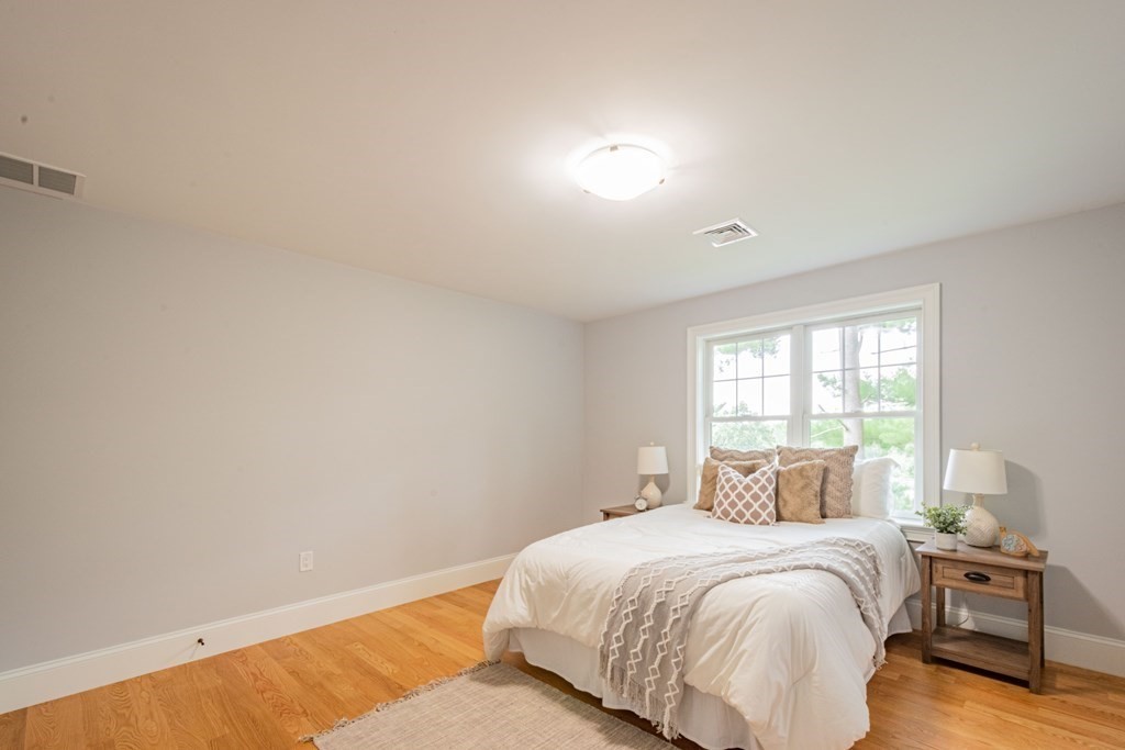 18 Pine Knoll Road Lexington, MA 02420 - Photo 29 of 42 a bedroom with a bed and a window