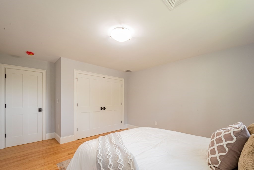 18 Pine Knoll Road Lexington, MA 02420 - Photo 30 of 42 a bedroom with a bed and a window