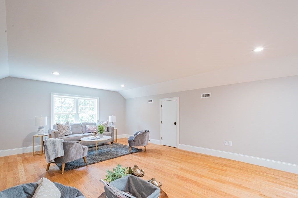 18 Pine Knoll Road Lexington, MA 02420 - Photo 34 of 42 a living room with furniture a window and a table