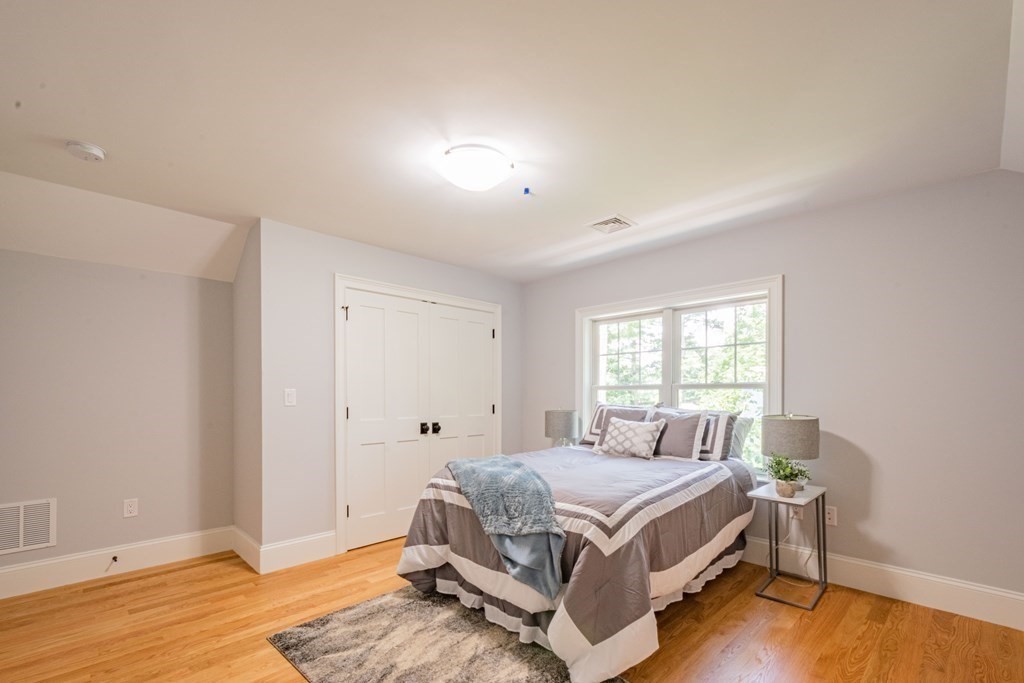 18 Pine Knoll Road Lexington, MA 02420 - Photo 36 of 42 a room with a bed and wooden floor