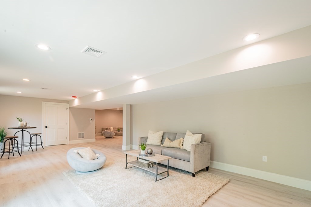 18 Pine Knoll Road Lexington, MA 02420 - Photo 39 of 42 a living room with furniture and a table