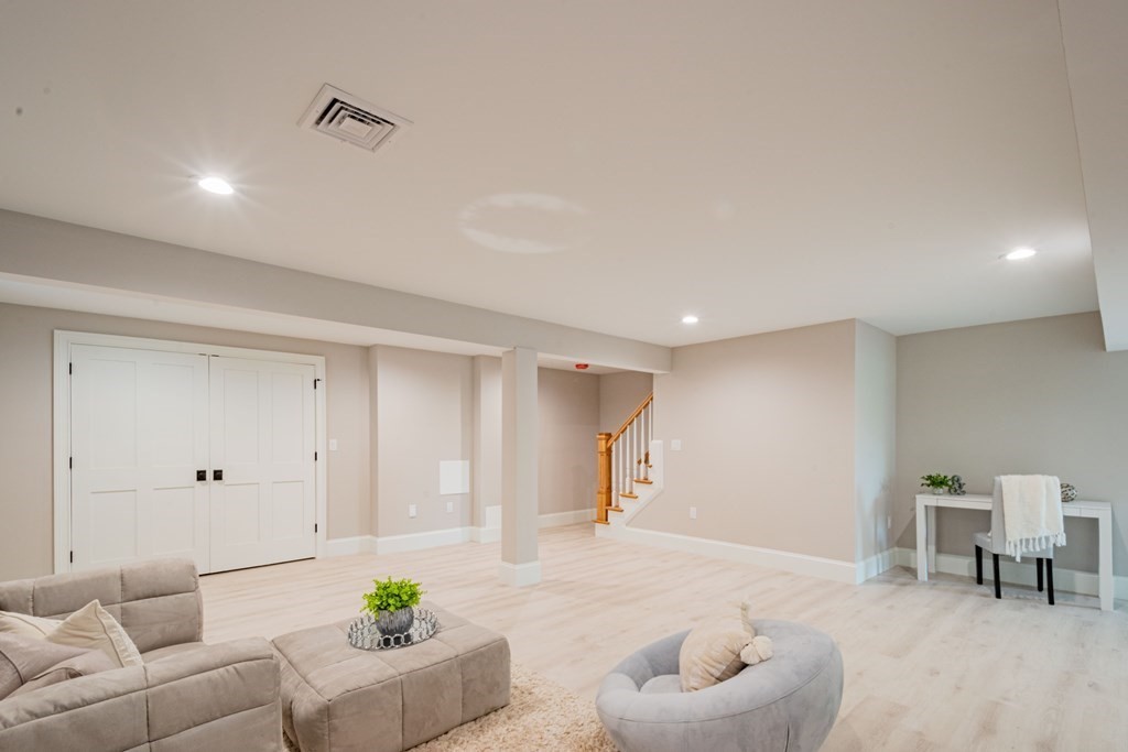 18 Pine Knoll Road Lexington, MA 02420 - Photo 40 of 42 a living room with furniture and a couch