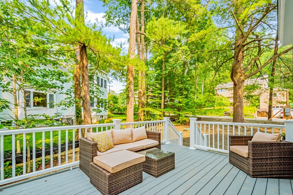 18 Pine Knoll Road Lexington, MA 02420 - Photo 41 of 42 a view of a deck with couches wooden floor and fence