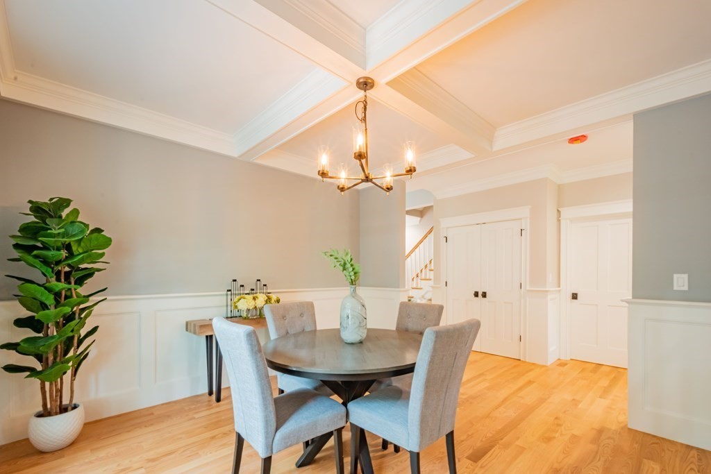 18 Pine Knoll Road Lexington, MA 02420 - Photo 8 of 42 a view of a dining room with furniture and a chandelier
