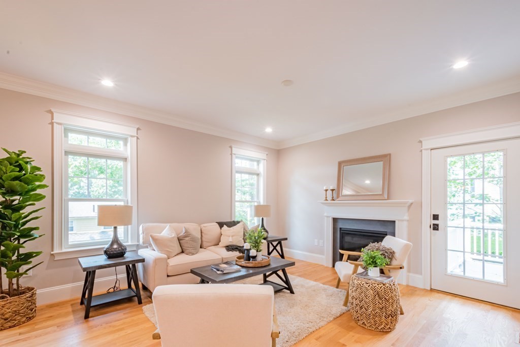 18 Pine Knoll Road Lexington, MA 02420 - Photo 9 of 42 a living room with furniture and a fireplace