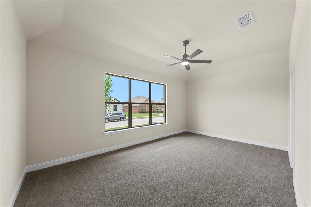 1508 Addison Lane Lancaster, TX 75134 - Photo 8 of 20 Spacious room featuring vaulted ceilings, neutral-toned walls, and plush carpeting